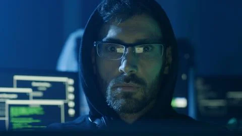 Portrait of hardworking pensive programmer working on data code in a software Stock Photos