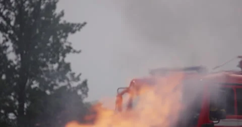 Portrait of a heroic fireman in a protective suit. Firefighter in fire fighting Stock Footage 283089136