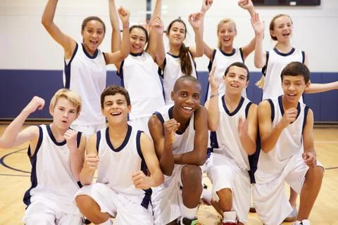 Portrait Of High School Sports Team In Gym Stock Photos