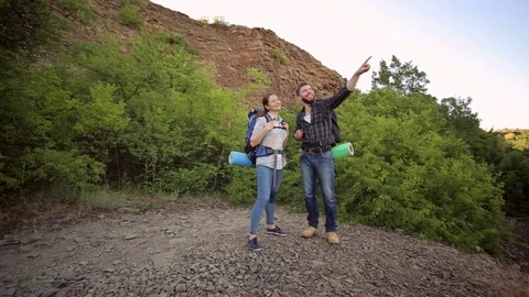 Portrait of hikers with backpacks in the mountains Stock Footage
