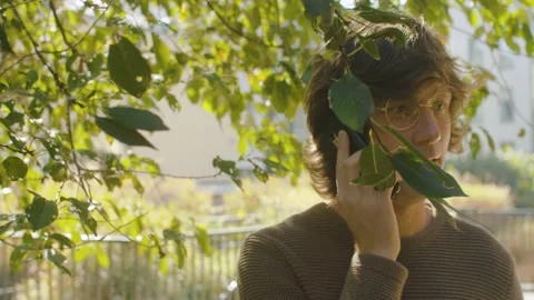 Portrait of hipster talking by smartphone Stock Footage 142443826