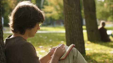 Portrait of hipster writing in a diary Video stock 142458483