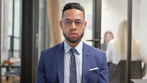 Portrait of Hispanic Businessman Looking at Camera 動画素材 307908396