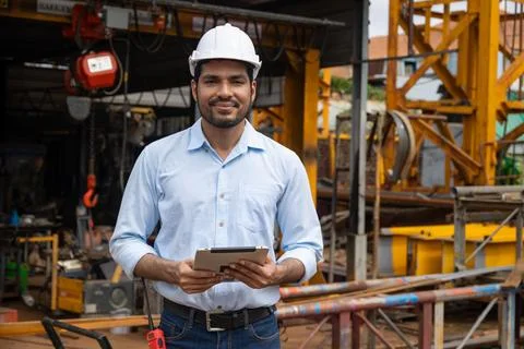 Portrait Hispanic Indian construction engineer male worker at construction .. Stock Photos