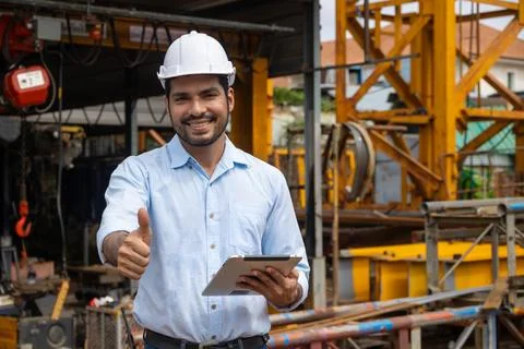 Portrait Hispanic Indian construction engineer male worker at construction .. Stock Photos