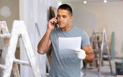 Portrait hispanic man having mobile phone conversation Stock Photos
