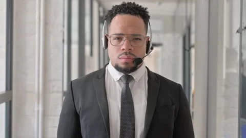 Portrait of Hispanic Man with Headset in Call Center Vidéo 305734598