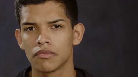 Portrait of a hispanic man with a serious face and then smiling Stock-Footage 70080549