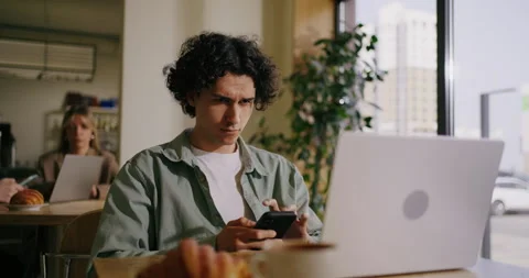 Portrait Of Hispanic Man With Smartphone Sitting In Cafe, Messaging In Mobile Stock Footage 276845836