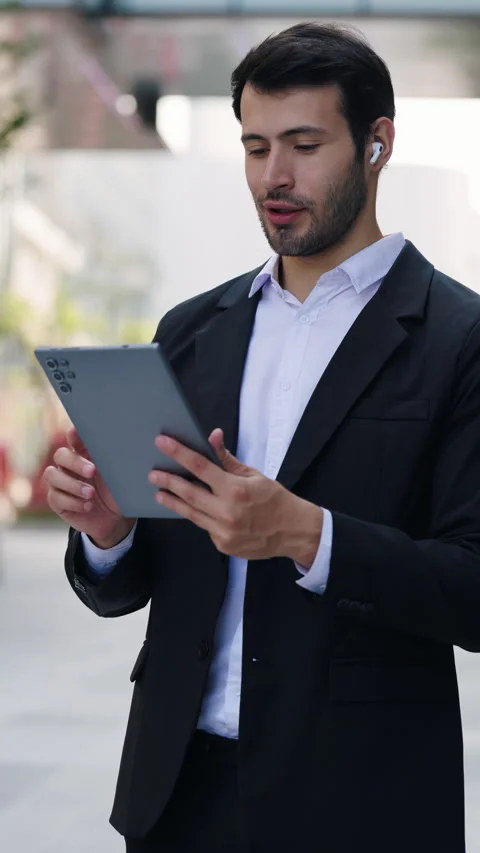 Portrait of Hispanic man waves hand Hello on video call via digital tablet Stock Footage 327890359