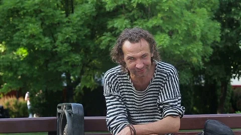 Portrait of a homeless man looking into the camera Stock Footage 76414032