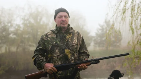 Portrait of a hunter smiling at the camera Video stock 196619756