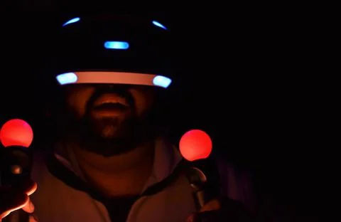  portrait of an impressed man using the virtual reality glasses Stock Photos