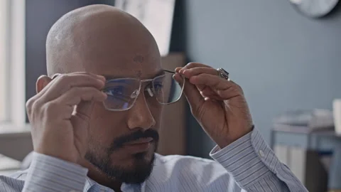 Portrait of Indian Male Developer Removing Glasses and Looking at Camera Stock Footage 337492459