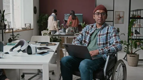 Portrait of Indian Male Software Developer with Disability in IT Startup Office Stock Footage 285708010