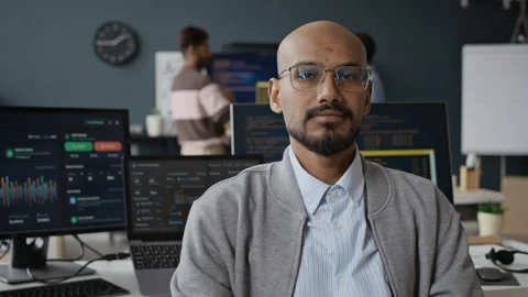 Portrait of Indian Male Software Developer Looking at Camera in Modern Office Stock Footage 337477260