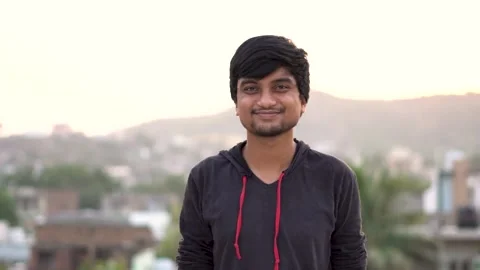 Portrait of an Indian man smiling while staring at the camera Stock Footage 144755109