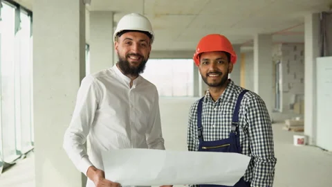 Portrait of a indian worker and architect engineer in a construction site Stock Footage 236484482