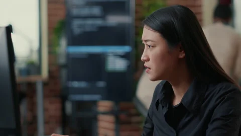 Portrait of infuriated software developer focused on writing code after Stock Footage 168232363