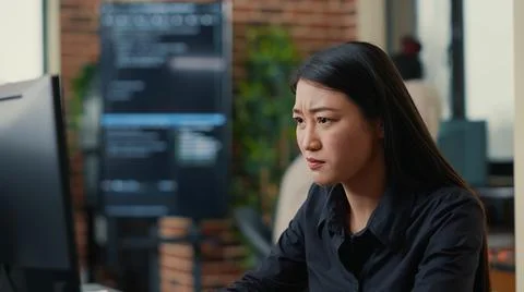 Portrait of infuriated software developer focused on writing code after 스톡 사진