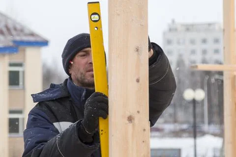 Portrait of an installer with a level in hand Fotos Stock