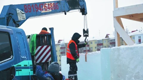 Portrait of installer at unloading ice blocks Stock Footage 106077390