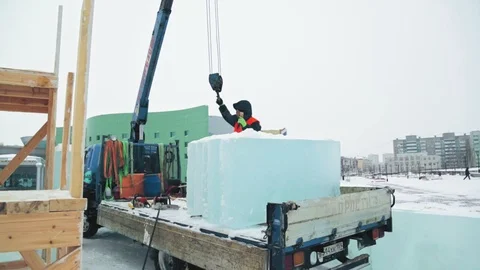 Portrait of installer at unloading ice blocks Stock Footage 106078139