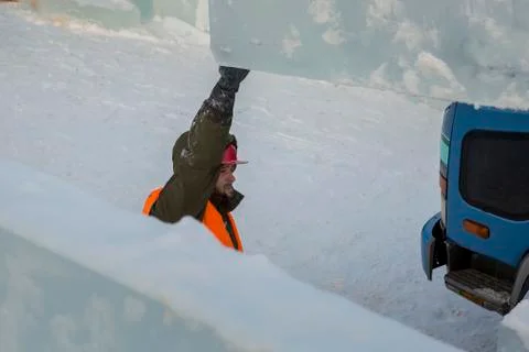 Portrait of installer at unloading ice blocks 写真素材
