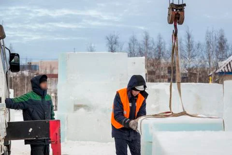 Portrait of installer at unloading ice blocks 스톡 사진