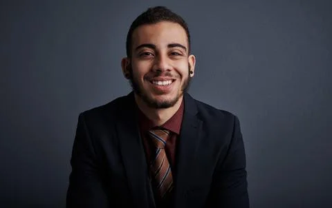 Portrait, intern and man in studio with smile, pride and skill development .. Stock Photos
