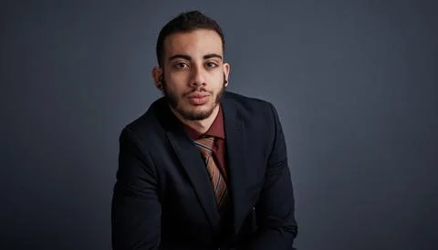 Portrait, intern and man in studio with pride, space and skill development .. Stock Photos