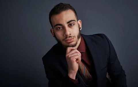 Portrait, intern and man in studio with space, pride and skill development .. Stock Photos