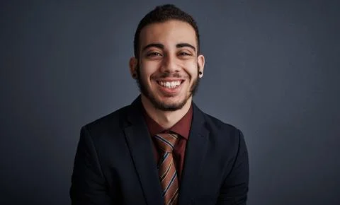 Portrait, intern and man in studio with smile, pride and skill development .. Stock Photos