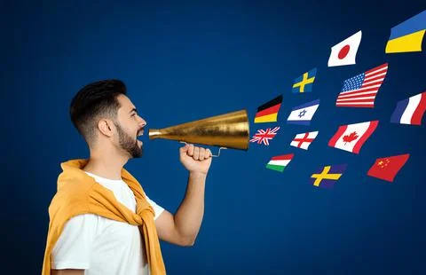 Portrait of interpreter with megaphone and flags of different countries on bl Stock Photos