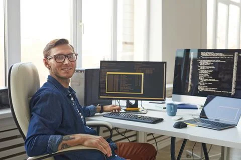 Portrait of IT Programmer Using Computers with Code on Screen 스톡 사진