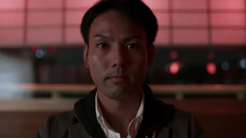 Portrait of a Japanese man sitting at a table inside of a cruise ship with soft Stock Footage 199459676