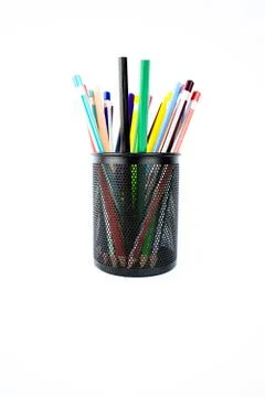 Portrait of a jar full of different colored pencils and crayons on a white ba Stock Photos