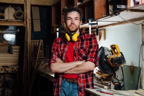 Portrait of the joiner in the workshop. Stock Photos