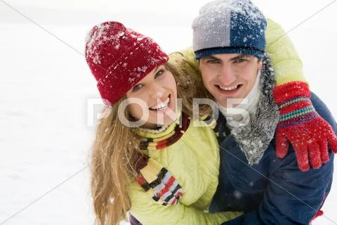 Portrait of joyful couple having a fun outdoor in winter Stock Photos