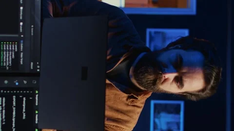 Portrait of joyful developer writing lines of code on notebook, close up Stock Footage 265107323