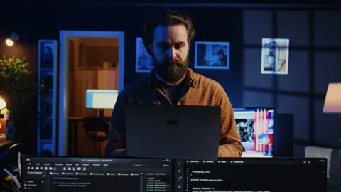 Portrait of joyful developer writing lines of code on notebook, close up Stock Footage 265507370