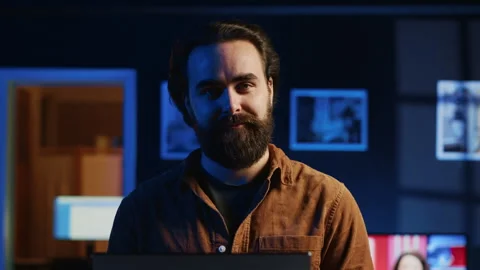 Portrait of joyful developer writing lines of code on notebook, close up Stock Footage 265619799