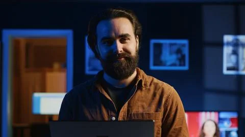 Portrait of joyful developer writing lines of code on notebook, close up Foto stock