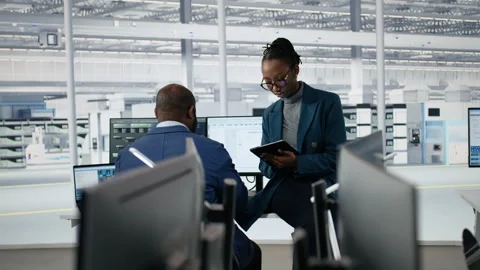 Portrait of joyous female engineer in microchip factory RD office Stock Footage 335880940