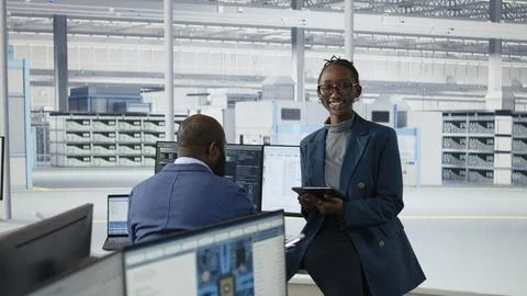 Portrait of joyous female engineer in microchip factory RD office Stock Photos