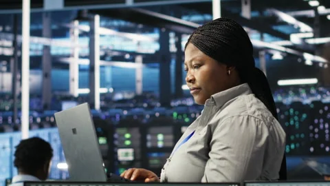 Portrait of joyous server hub technician using AI visualization insights Stock Footage 307019646