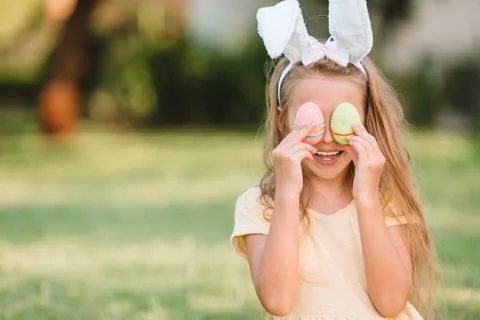 Portrait of kid with easter busket with eggs outdoor Stock Photos