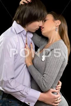 Portrait of a kissing loving couple Stock Photos
