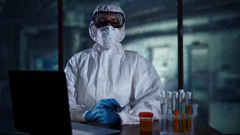 Portrait of Laboratory worker looking at the camera, analyzing samples in test Stock Footage 95352388