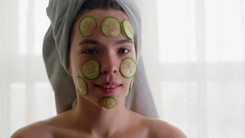 Portrait of Lady with Cucumber Slices on Face Blinking Eyes Enjoying Skincare Stock Footage 308593860